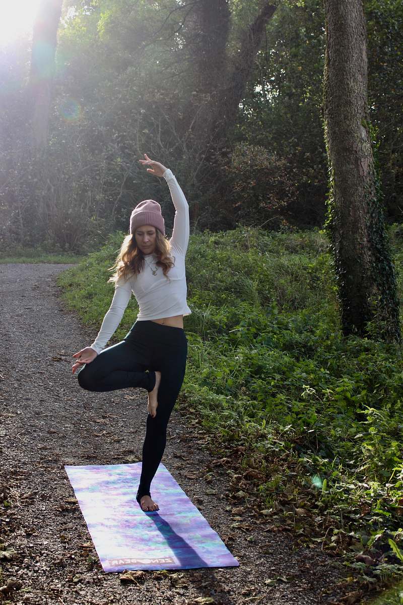 working out woman doing yoga post on mat fitness